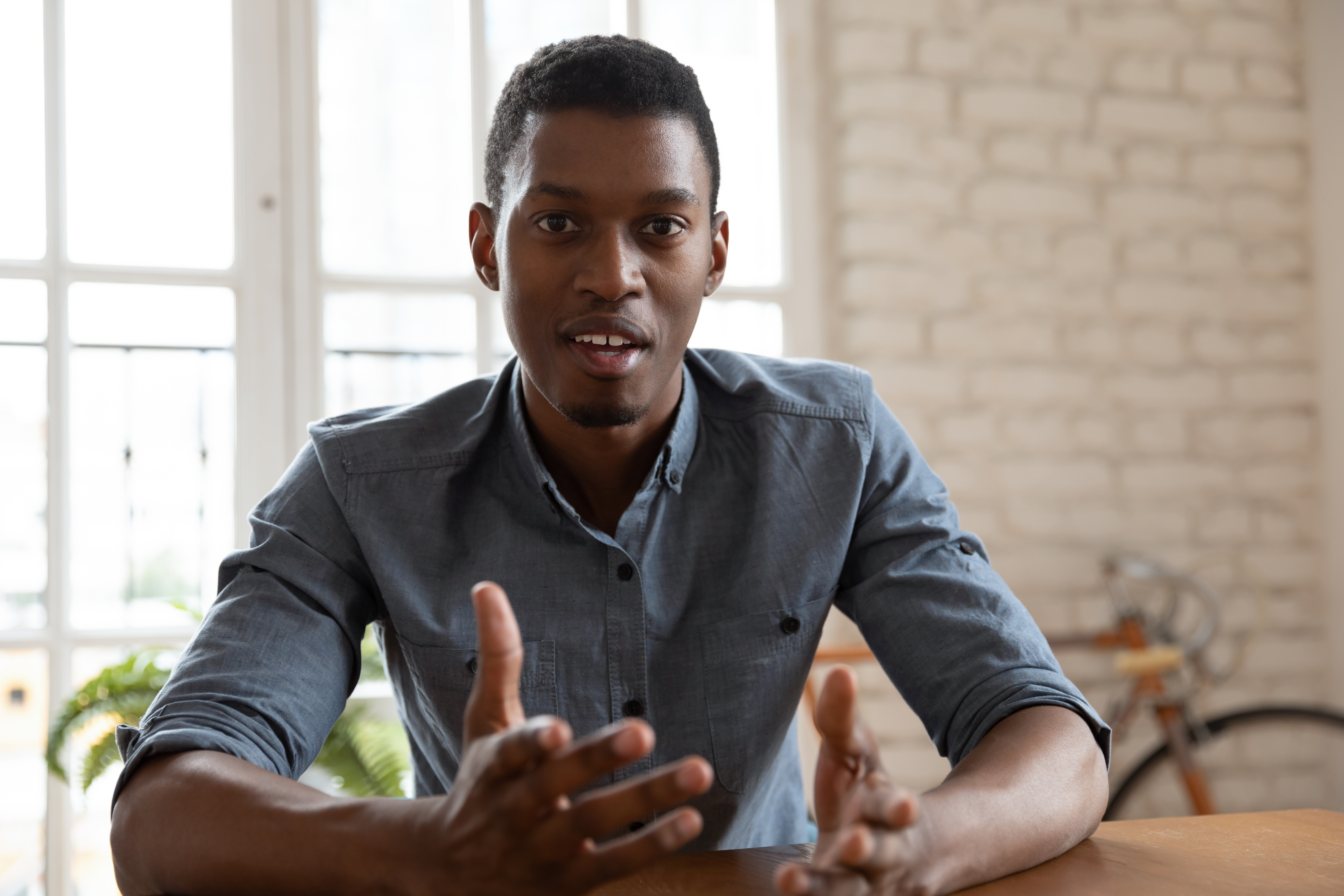 man talking intently with hands
