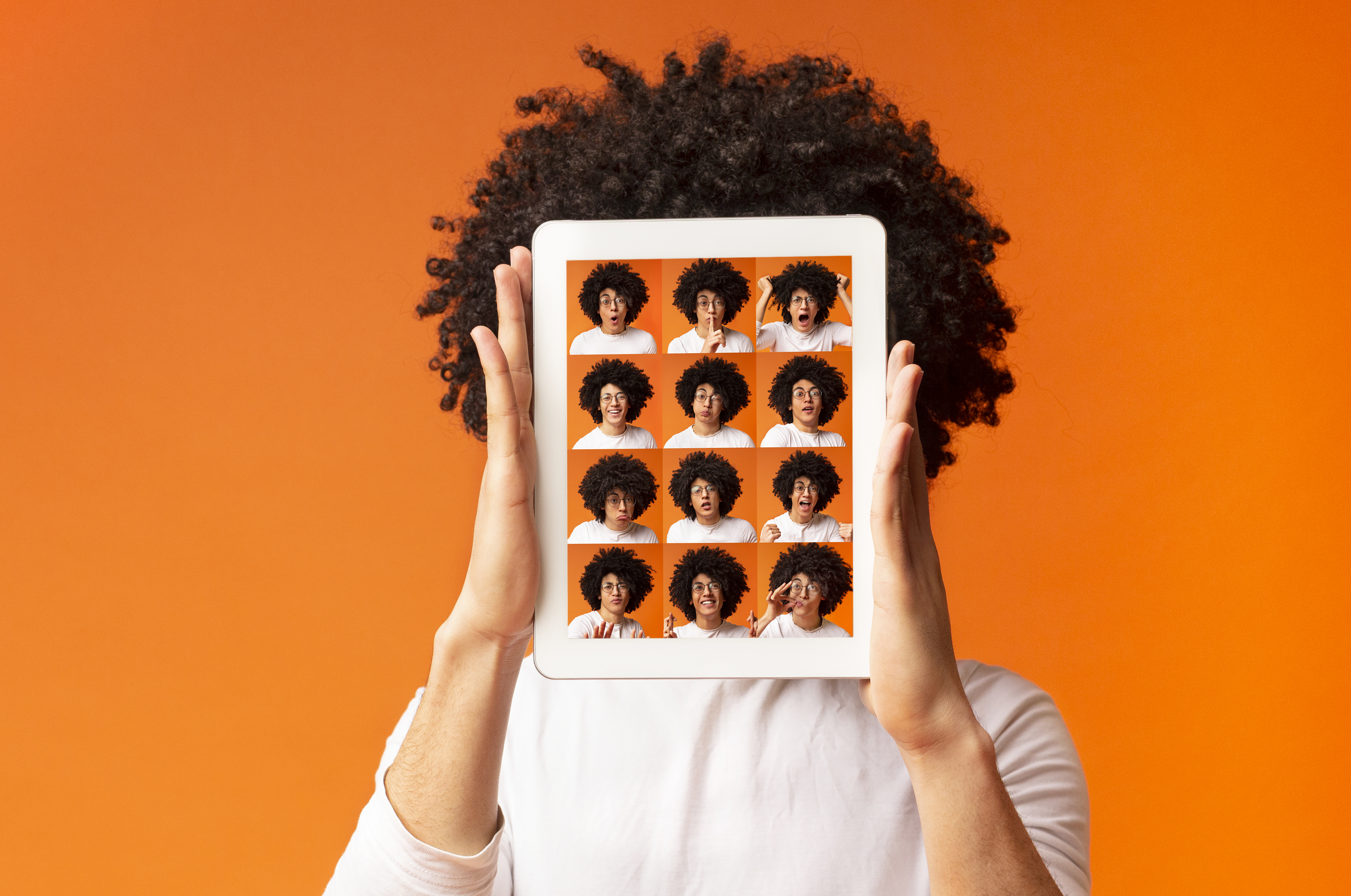 Photo with woman holding up different versions of herself on a screen