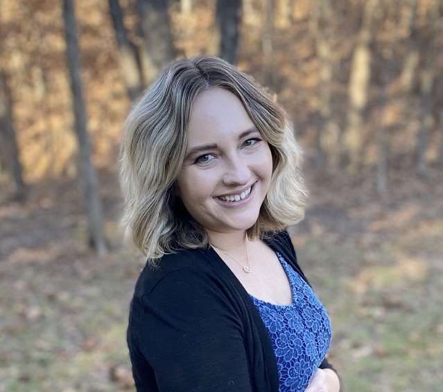 Woman smiling with black sweater