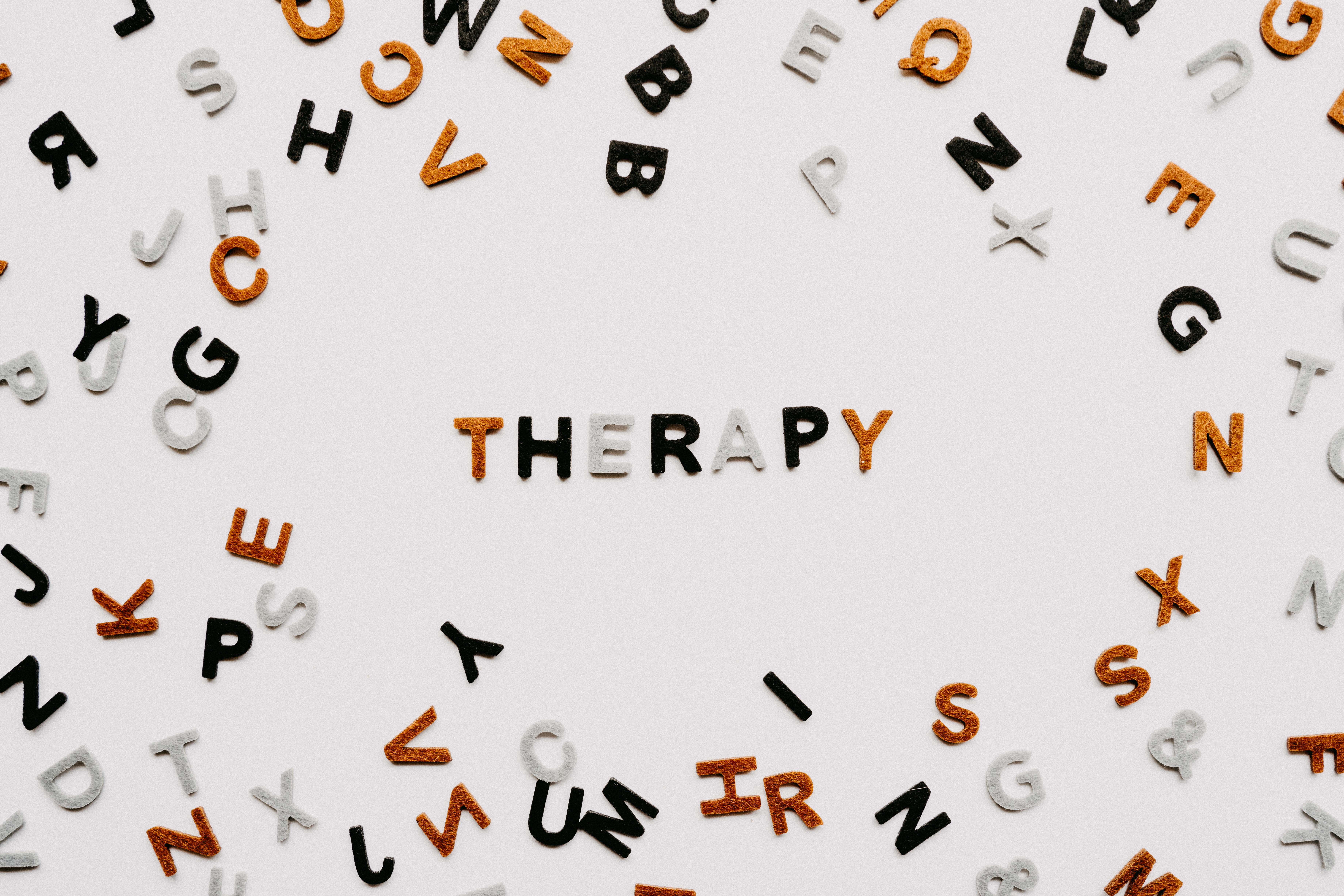Therapy spelled out in scrabble letters