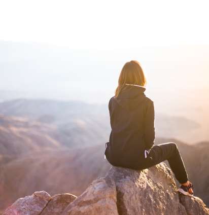 Depressed woman on a precipice contemplate life in St. Louis, MO