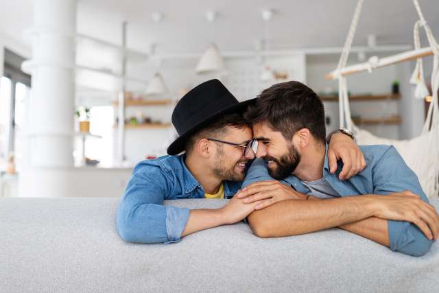 A couple smiles next to each other. This relates to couples counseling in St. Louis, MO. Our marriage counselor in St. Louis, MO can help you through marriage counseling in St. Louis, MO.