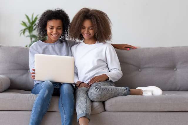 A mom and daughter use a computer. This relates to concepts of child therapy in St. Louis, MO. Our child therapist in St. Louis, MO offer effective child therapy. 