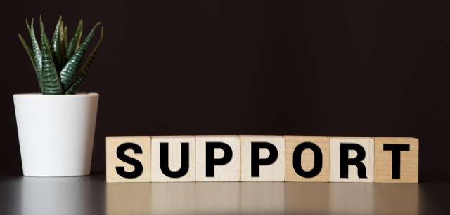A sign reads "support." This relates to concepts on online eating disorder treatment in Kansas City, MO and eating disorder treatment in St. Louis, MO. 