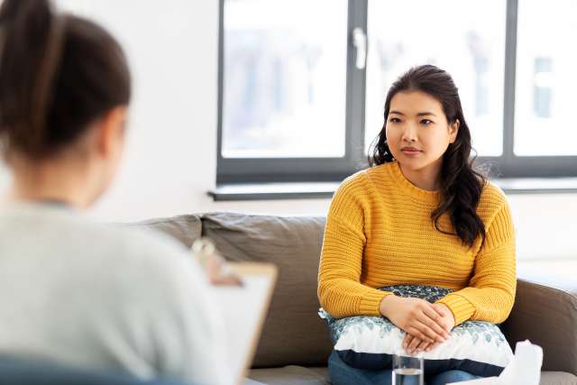 A person sits in therapy. This relates to concepts of therapy in Independence, MO. Our therapist in Independence, MO offer online therapy in Kansas City, MO. 