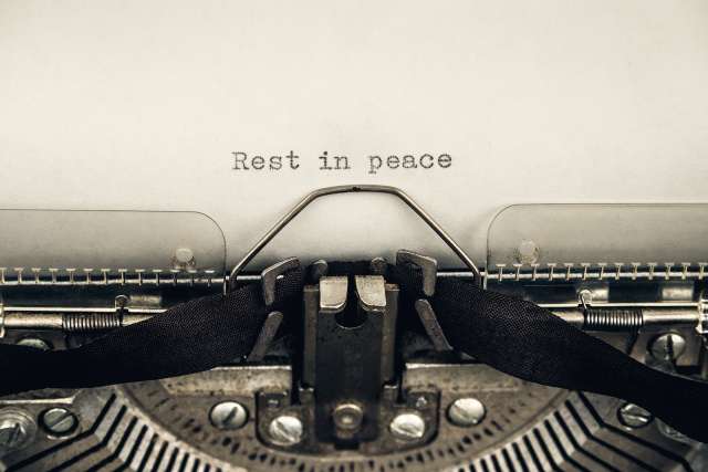 A typewriter writes "rest in peace." This relates to concepts of grief counseling in Kansas City, MO. Our grief counselor in Kansas City, MO offer effective grief counseling in Kansas City, MO.