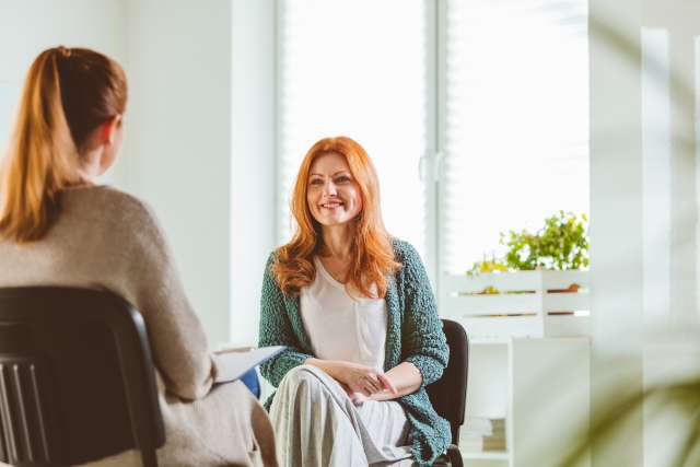 Woman in therapy with a mental health provider from Open Arms Wellness in St. Louis