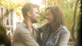 Couples looking into each others eyes while in a hug