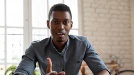 man talking intently with hands