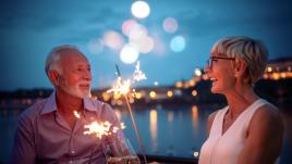 Two seniors celebrating with sparklers