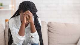 A woman appears upset. This demonstrates aspects of sexual assault. Our therapists provide therapy in St. Louis, MO for sexual assault.