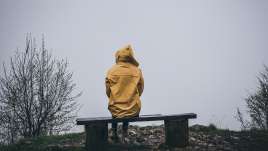 A person sits on a bench. This reflects aspects of therapy in St. Louis, MO. Our therapist in St. Louis, MO provide helpful therapy.