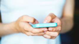 A person uses a phone. This relates to therapy in St. Louis, MO. Our therapists in St. Louis, MO offer therapy in St. Louis, MO.