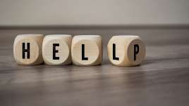 Blocks read "help." This relates to concepts of trauma therapy in Independence, MO. Our trauma therapist in Independence, MO offer online therapy in Kansas City, MO.