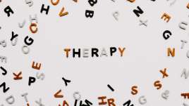 Therapy spelled out in scrabble letters