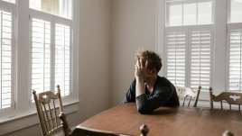 Sad person with windows, therapy, counseling, psychiatry in St. Louis